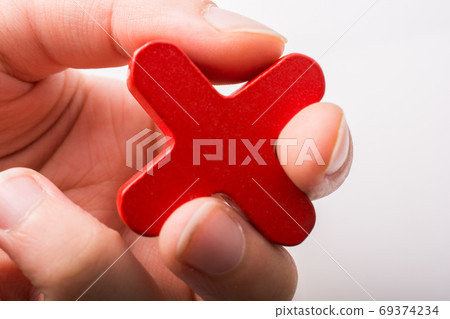 Hand holding Letter cube X of Alphabet Hand holding Letter cube X of Alphabet 69374234