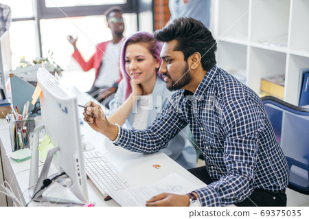 Business people at work in a busy luxury office space Business people at work in a busy luxury office space 69375035