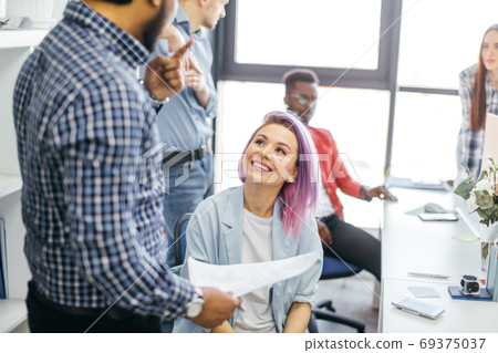 Business people at work in a busy luxury office space 69375037