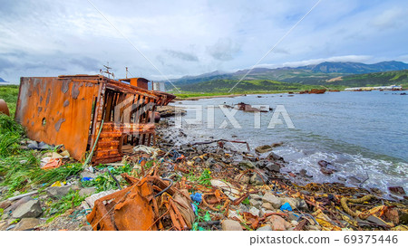 Plastic rubbish pollution in ocean. Ship ropes and nets thrown directly into the sea with no proper trash collection or recycling. Dump of old rusty ships. Dirty background Plastic rubbish pollution in ocean. Ship ropes and nets thrown directly into the sea with no proper trash collection or recycling. Dump of old rusty ships. Dirty background 69375446