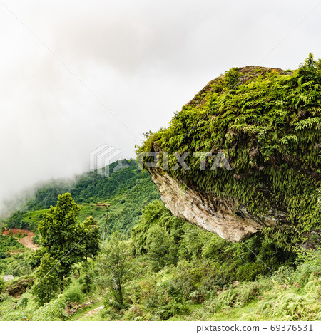Picture of Himalayas mountains covered with fog Picture of Himalayas mountains covered with fog 69376531
