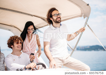 Young friends sailing in caribbean sea 69376758