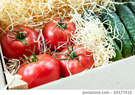 Wooden and cardboard crate box with fresh ripe 69377410