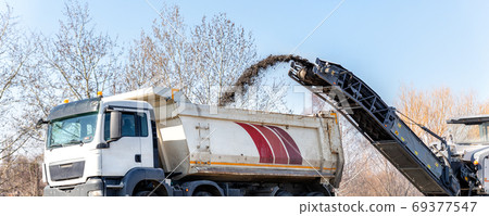 Asphalt milling and grinding machine at road Asphalt milling and grinding machine at road 69377547