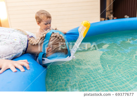 Cute adorable caucasian blond little girl making Cute adorable caucasian blond little girl making 69377677