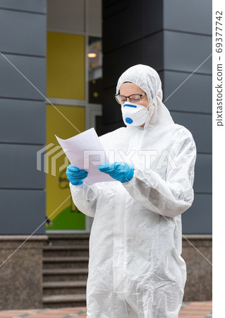 Portrait of tired exhausted female doctor, 69377742