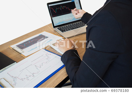 Business trader woman analyze stock graph and report, set targets for online trading management Business trader woman analyze stock graph and report, set targets for online trading management 69378180