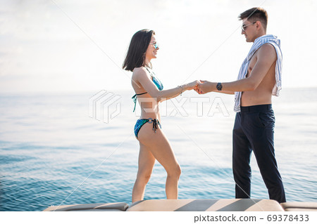 two beautiful girls enjoying a trip on a boat in Bali, Indonesia 69378433