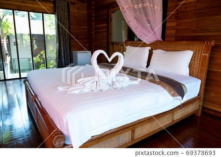 Picture of a bedroom in a modern room with ready for relaxation 69378693