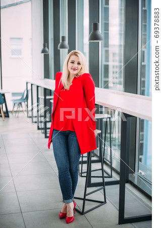 Attractive successful business lady in a red suit Attractive successful business lady in a red suit 69378883