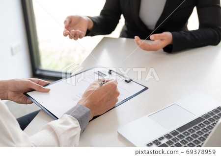 Office executives are interviewing job applicants in the meeting room Office executives are interviewing job applicants in the meeting room 69378959