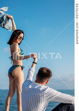 Caucasian couple in love relaxing on yacht bow, Travelling lifestyle concept 69379149