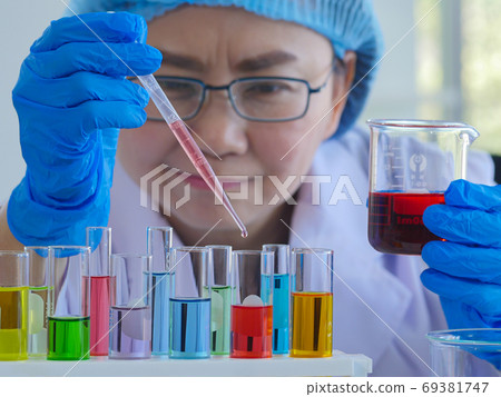 Senior scientists working in the laboratory 69381747