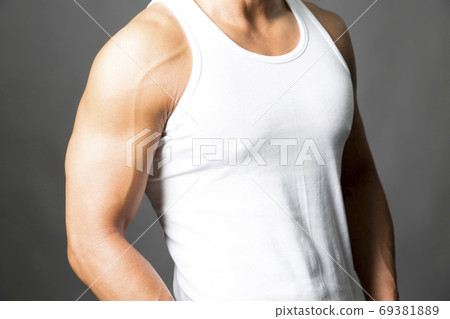 Macho man in a tank top - Stock Photo 