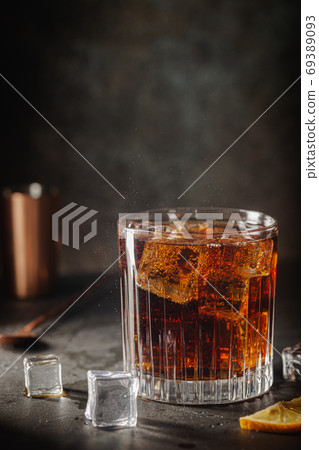 Glass of cola with ice Glass of cola with ice 69389093
