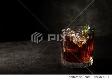 Glass of cola with ice Glass of cola with ice 69389094