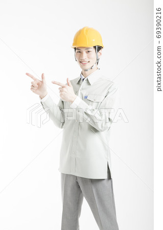 Male worker pointing 69390216