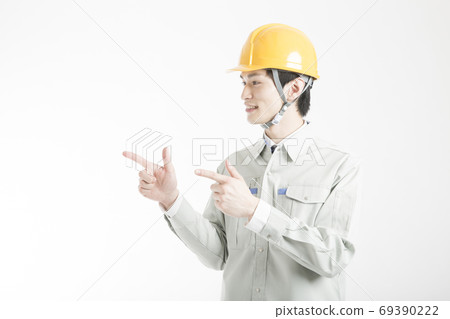 Male worker pointing 69390222