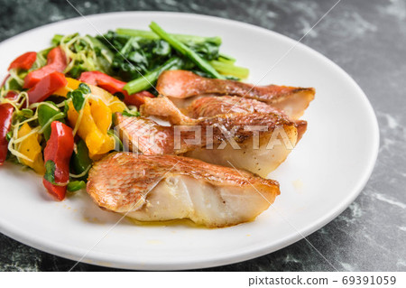 Grilled red fish with butter Grilled red fish with butter 69391059