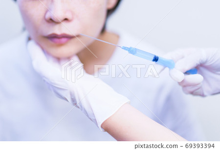 Botox injection [Image of cosmetic surgery] 69393394