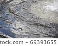 The surface of the fountain, the blue sky reflected a little 69393655