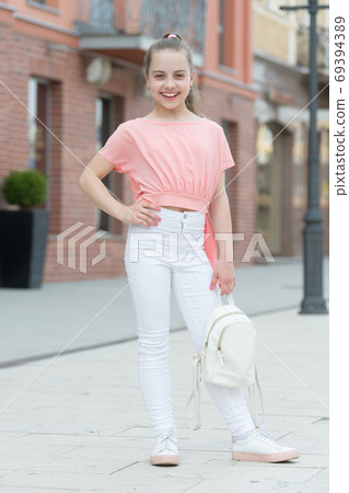 True style never dies. Adorable small girl in street fashion 69394389