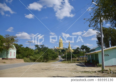 Next to the giant Buddha statue in Monywa, Myanmar 69395130