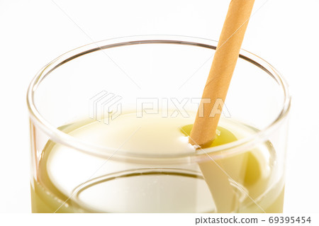 Vegetable juice with a paper straw. 69395454