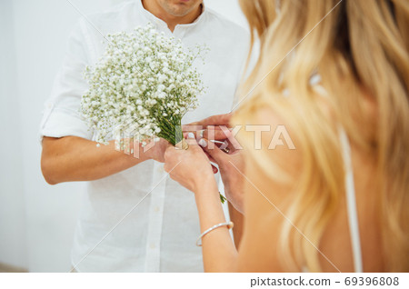 Hands of the bride and groom. Bride and groom holding hands at a wedding ceremony. Hands of the bride and groom. Bride and groom holding hands at a wedding ceremony. 69396808