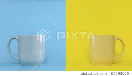 Blue cup on blue background and yellow cup on yellow background Blue cup on blue background and yellow cup on yellow background 69398069