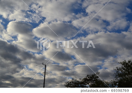 Clouds and utility poles 69398769