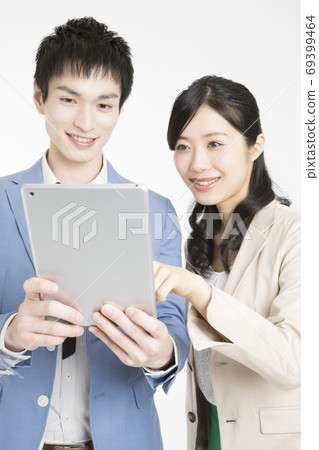 Boss and subordinates looking at tablet PC Boss and subordinates looking at tablet PC 69399464