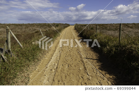 Sandy path to the beach Sandy path to the beach 69399844