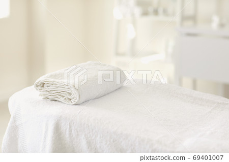 The interior of the beauty salon. Workplace of a cosmetologist maasagist. White dermatologist office. 69401007