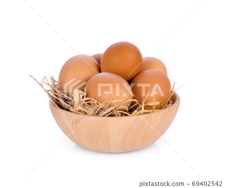 eggs in wooden bowl isolated on white background 69402542
