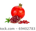 pomegranate fruits with leaf and seeds isolated on white backgro 69402783