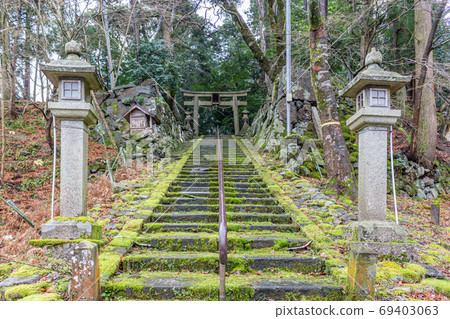 Stone lanterns and stone steps at shrine, Fukui Prefecture, Japan. Stone lanterns and stone steps at shrine, Fukui Prefecture, Japan. 69403063