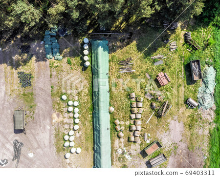 Detailed view from the air of a storage place for a farm Detailed view from the air of a storage place for a farm 69403311