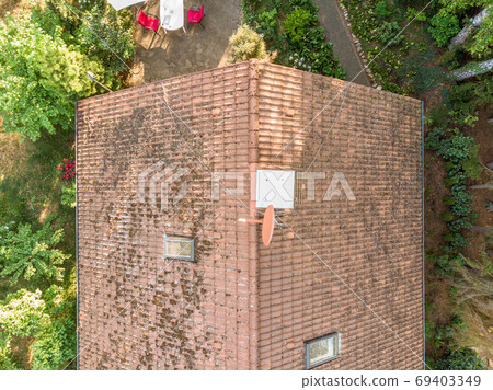 Checking the roof of a house with a drone 69403349