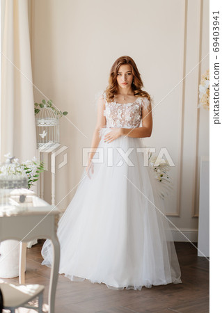 bride in stands near wall waiting of ceremony 69403941