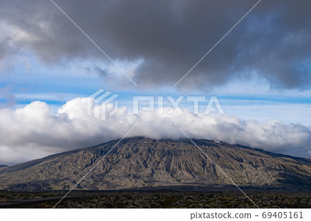mountain of Snaefellsjokull National Park with white cloudy cap on peak. Iceland mountain of Snaefellsjokull National Park with white cloudy cap on peak. Iceland 69405161