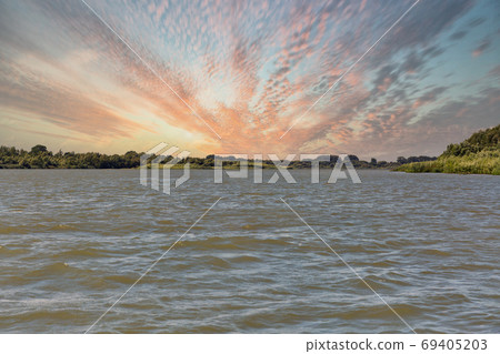 Danube river with dramatic sunset in Vilkove, Ukraine. 69405203