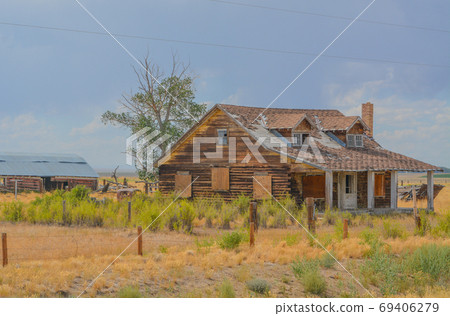 A rustic, rundown, old abandoned, ruined, farm house in the countryside of a prairie in Colorado A rustic, rundown, old abandoned, ruined, farm house in the countryside of a prairie in Colorado 69406279