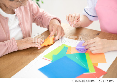 Caregiver rehabilitating seniors together 69406460