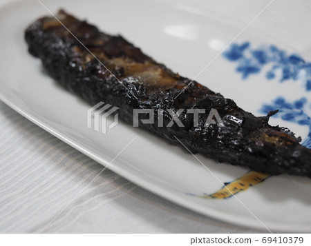 Dark brown saury grilled fish 69410379