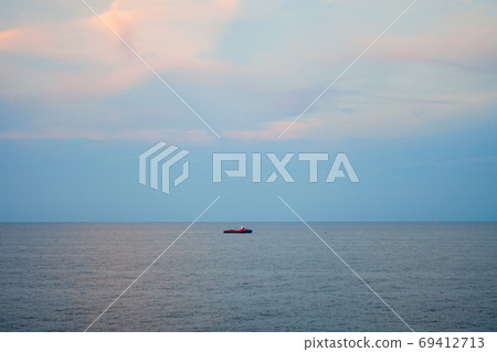 lonely sailing boat or crew boat in the sea with beautiful sky a lonely sailing boat or crew boat in the sea with beautiful sky a 69412713