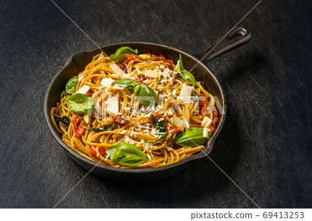 Dried tomato and basil pasta Dried tomato and basil pasta 69413253