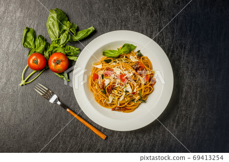 Dried tomato and basil pasta Dried tomato and basil pasta 69413254