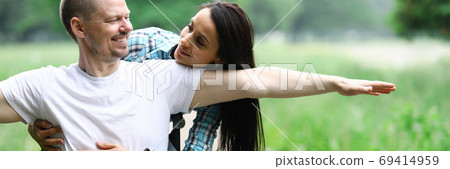 Happy couple on walk in park disabled wheelchair Happy couple on walk in park disabled wheelchair 69414959