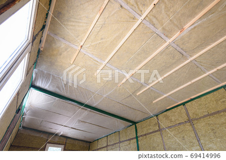 Insulation of the roof from the inside with mineral wool in a wooden country house 69414996